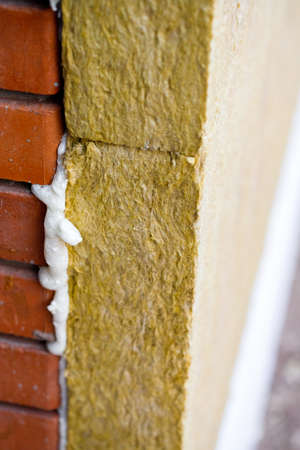 Thermal insulation material, rock wool. Thermal roof insulation layer. Mineral wool or mineral fiber, mineral cotton, mineral fibre, glass wool, MMMF, MMVF. Fiber thermal insulation close-up.の写真素材