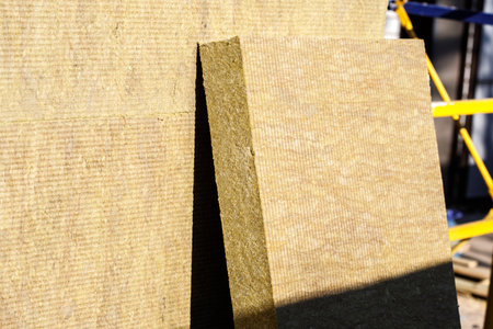 Thermal insulation material, rock wool. Thermal roof insulation layer. Mineral wool or mineral fiber, mineral cotton, mineral fibre, glass wool, MMMF, MMVF. Fiber thermal insulation close-up.の写真素材