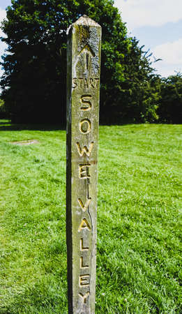 Canal wooden sign of direction to Sowe Valleyの写真素材
