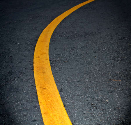 yellow lines on asphaltの写真素材