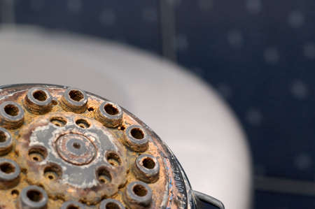 Damaged shower head with ground limestones.の写真素材