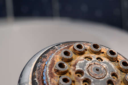 Damaged shower head with ground limestones.の写真素材