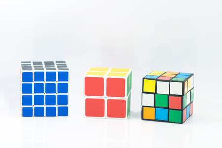 Bangkok, Thailand - November 11, 2017: Rubik's cube three type is good for brain on a white background. Rubik's Cube invented by a Hungarian architect Erno Rubik in 1974.のeditorial素材