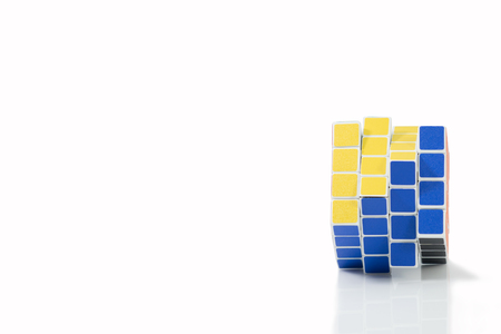 Bangkok, Thailand - November 11, 2017: Rubik's cube 44 is difficult for play but good for brain on a white background. Rubik's Cube invented by a Hungarian architect Erno Rubik in 1974.のeditorial素材