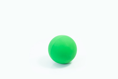 Pet supplies about rubber balls of green for pet on isolated white.の写真素材