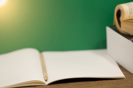 pencil in notebook with warm light on table : Concept about educationの写真素材