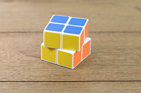 Bangkok- Thailand Rubik's cube on desk.   Rubik's Cube o cube toy puzzle, 2x2 square. Rubik's Cube invented by a Hungarian architect Erno Rubikのeditorial素材