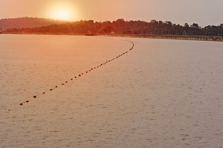 Blurred Water storage dam with sunsetの写真素材