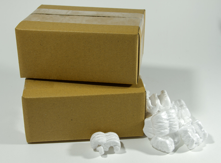 Cardboard box isolated on whiteの写真素材