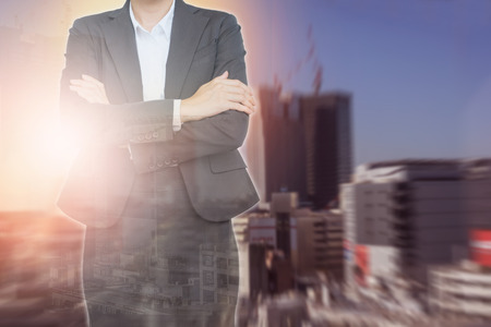 Business woman wearing suits on building abstract background.の写真素材