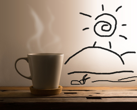 White mug in early morning with art background on table.の写真素材