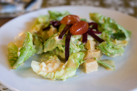 Caesar salad in white ceramic plate.の写真素材