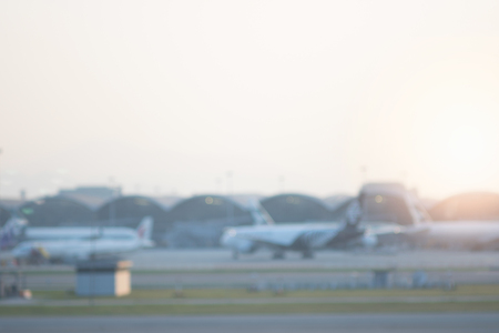 Blurred airport with airplanes on runway.の写真素材