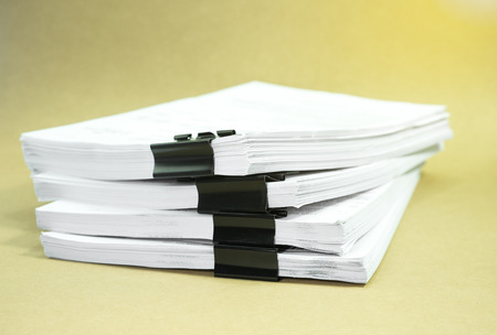 Stack documents on cardboard brown paper in concept save Earth and use paper economically and...
