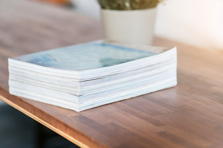 Stack of magazines on table living roomの写真素材