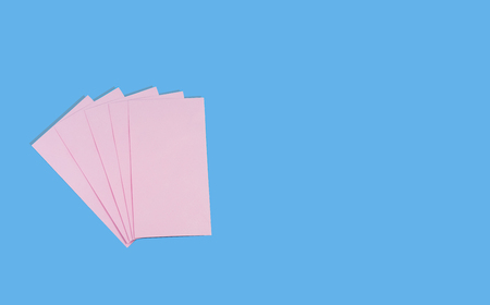 Pink envelope on blue background.の写真素材