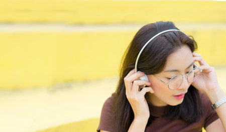 Asia women listening music with headphones for relaxの写真素材