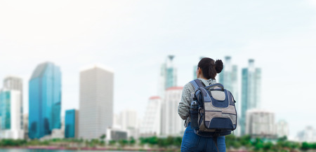 Women traveler with backpack on city background.の写真素材