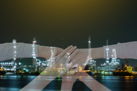 Double exposure of Business team for investment about Power plant business at night timeの写真素材