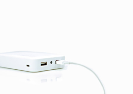 Battery external or Power bank for smartphone with cable on isolated white background.の写真素材