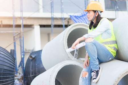 Engineering with hard hat at construction siteの写真素材