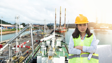 Engineering wearing yellow helmet and working at construction site about transportation of...