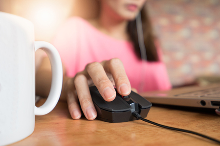 Hand using Computer mouse for online business workの写真素材