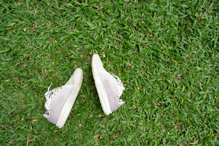 Sports Shoes on green grass.  Sport and relax concept.の写真素材