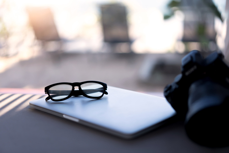 Eyes glasses on laptop. Traveler on summer holiday concept conceptの写真素材