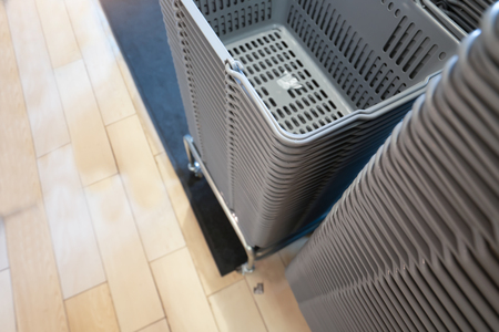 Stacked plastic basket at supermarket
