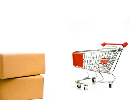Cardboard box and trolley cart on isolated white backgroundの写真素材