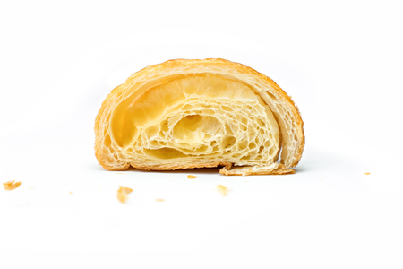 Croissant sliced on isolated white backgroundの写真素材