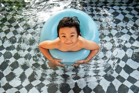 Little boy in the swimming pool. Summer holiday conceptの写真素材