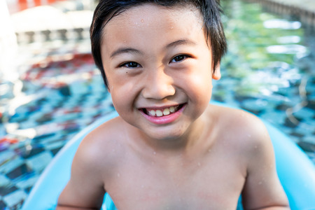 Little boy in the swimming pool. Summer holiday conceptの写真素材