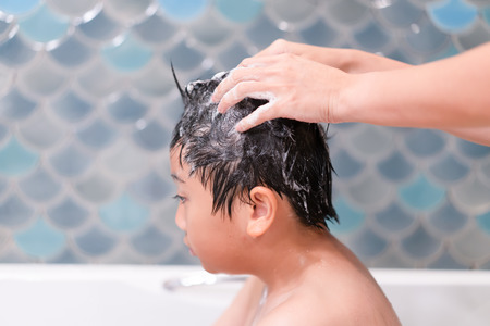 Little boy happy in shower at bathroomの写真素材