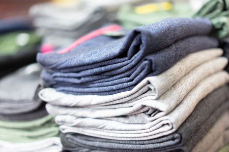 Stack T-shirts on shelf in a shop