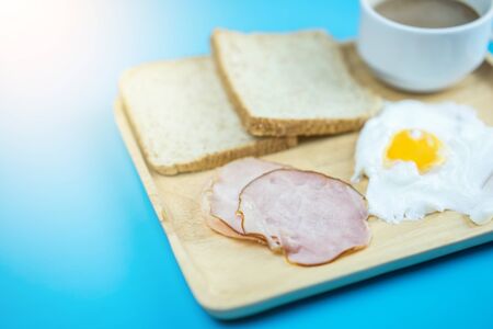 Breakfast set on blue background.  Food conceptの写真素材