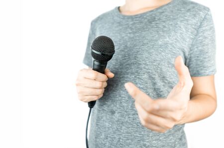 Business people holding microphone isolated on whiteの写真素材