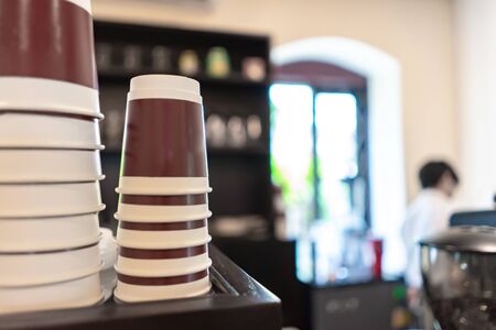 Blurred stack paper cup at coffee shopの写真素材