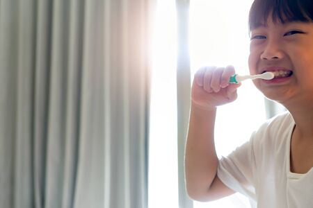 Little boy brushing teeth