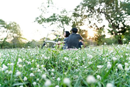 Green grass with blurred a couple.  Picnic outdoor concept.の写真素材