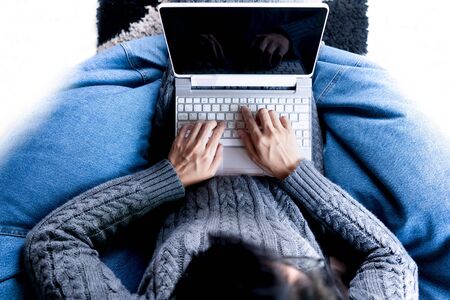 Top view woman using laptop for business onlineの写真素材