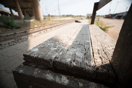 Wooden chair at train station