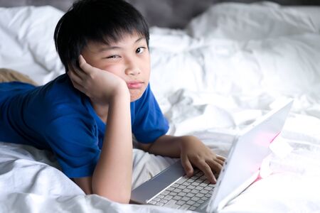 A boys tired of online learning at home.