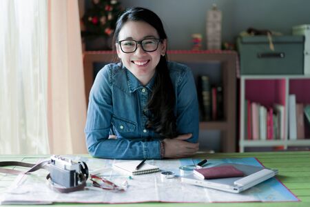 Portrait smile woman for planning travel and photographの写真素材