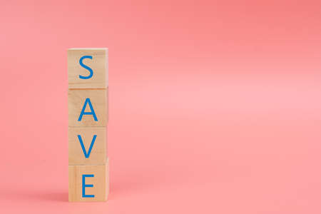 The word SAVE on the wood block on pinkの写真素材