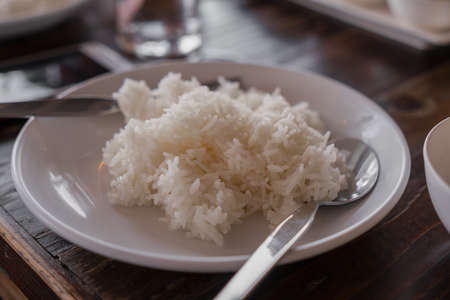 Rice in plates and utensils, ready to eatの写真素材