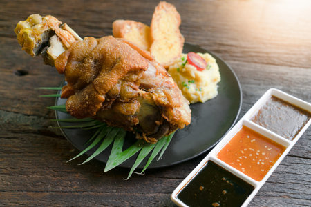 Crispy German Pork Knuckle with Beer Gravyの写真素材