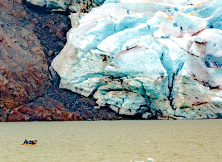 Juneau, AK, USA - May 25, 2016:  Kayakers are dwarfed as they approach to view moraine of the Mendenhall Glacier.のeditorial素材