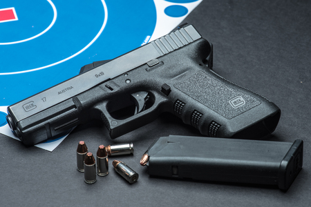 Las Vegas, NV, USA - January 25, 2016:  Closeup of  Glock 17 semiautomatic handgun and 9mm amunition...